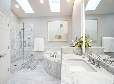 Finished primary bathroom with skylights, glass tile shower, mosaic tub surround and marble vanity, Leander